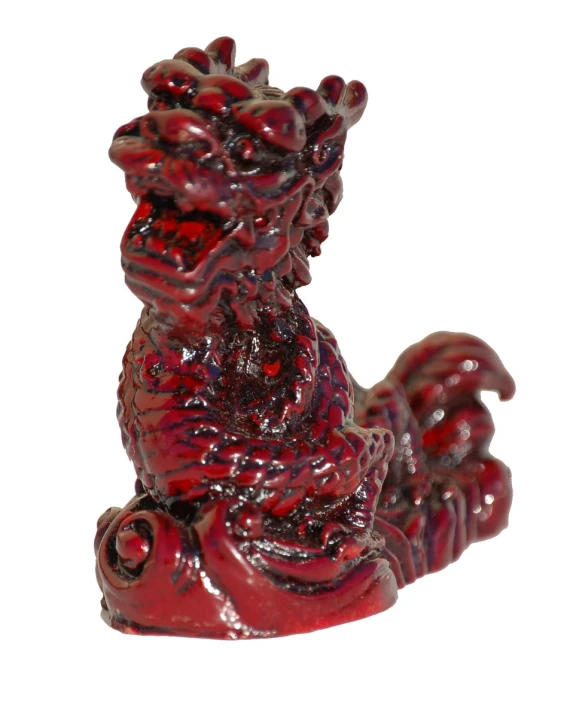 red chinese figurine on a white background
