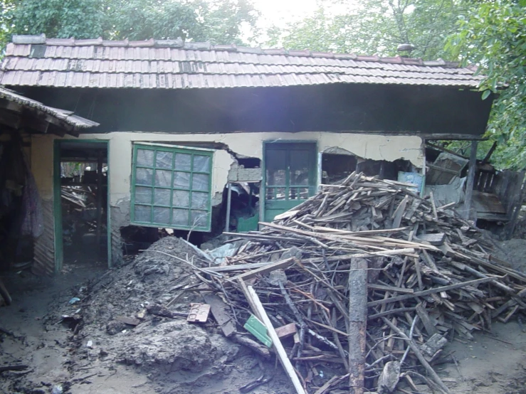 a pile of rubble is outside of a house