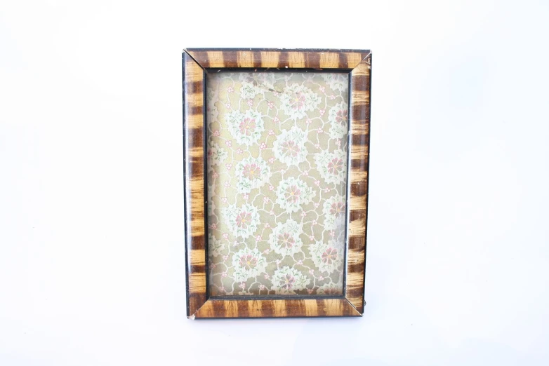 the picture frame has a floral design on it