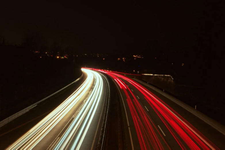 a street that has long exposure lights on it