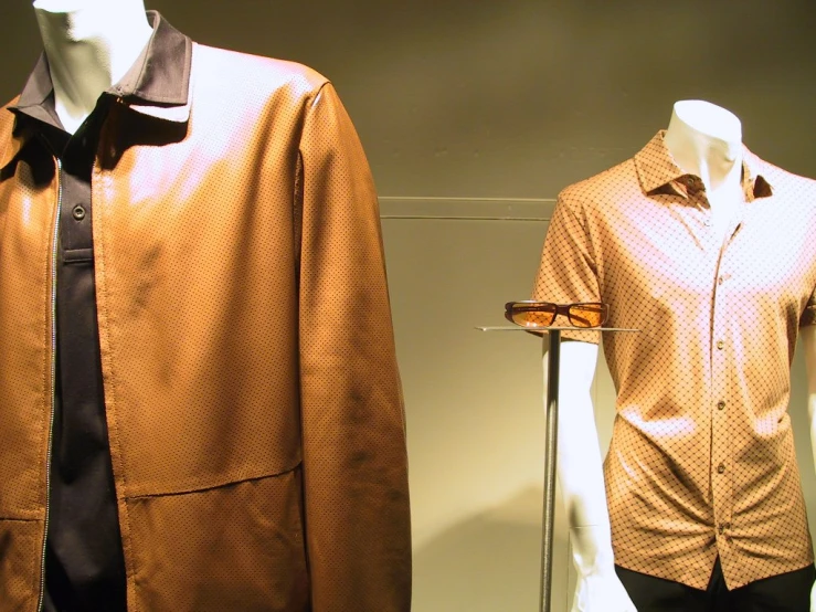 a couple of mannequins wearing matching clothes