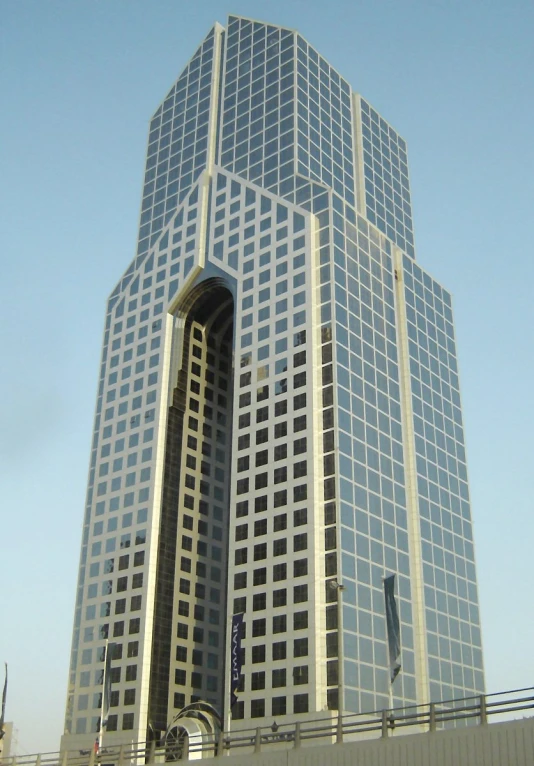 a very tall building with a huge circular entrance