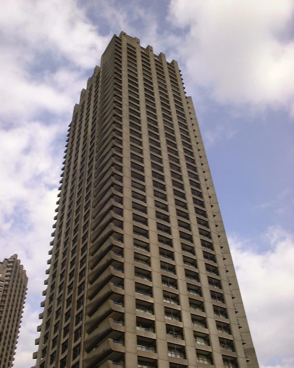 a tall building has multiple levels and balconies