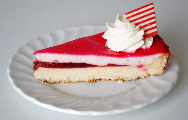 a piece of pie with ice cream and strawberry filling on top