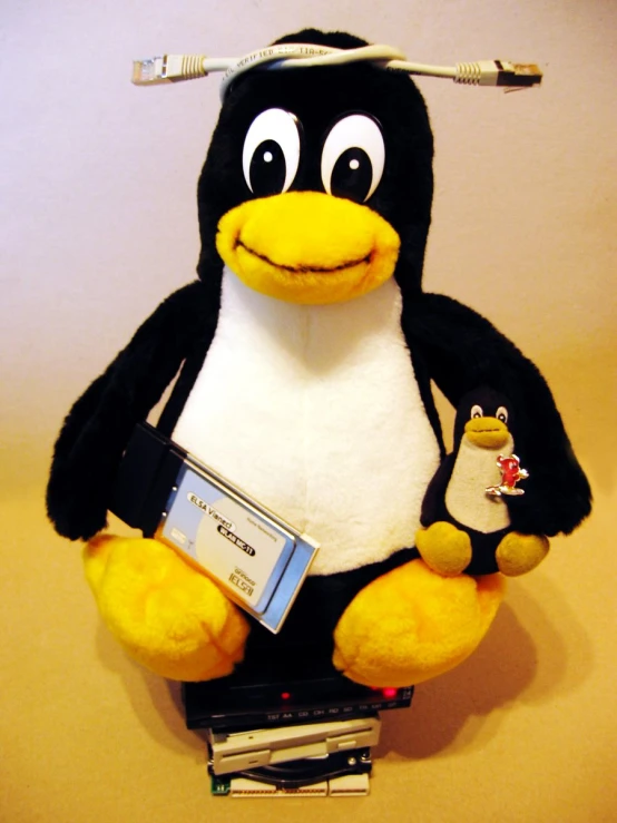 an image of stuffed penguin and tv set