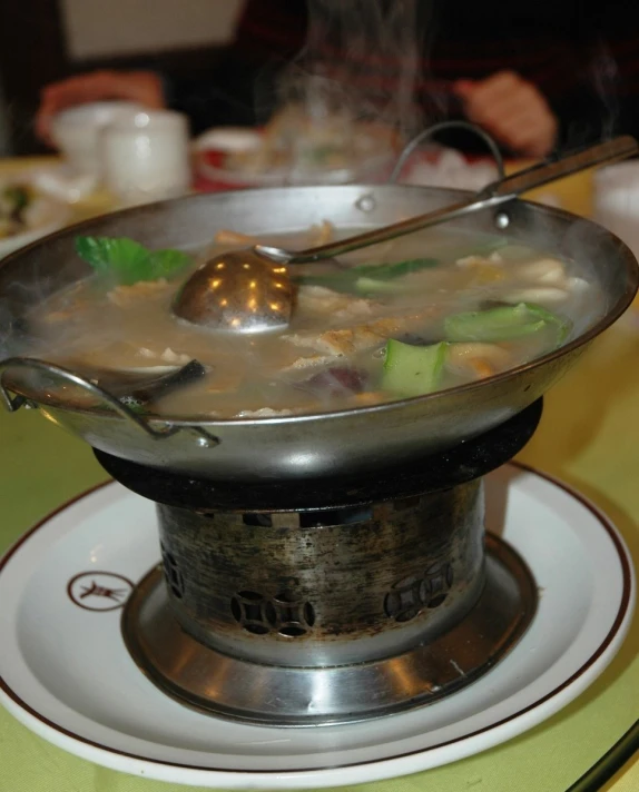 soup on a steamer in a silver bowl
