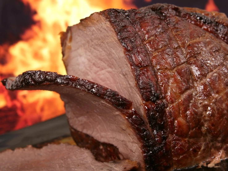 a close up of some meat on a grill