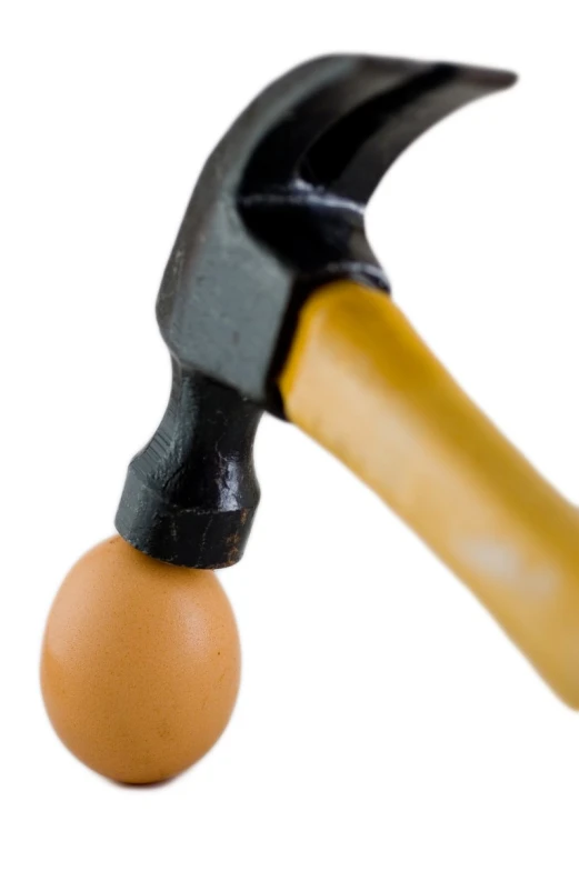 an egg that is stuck into a hammer