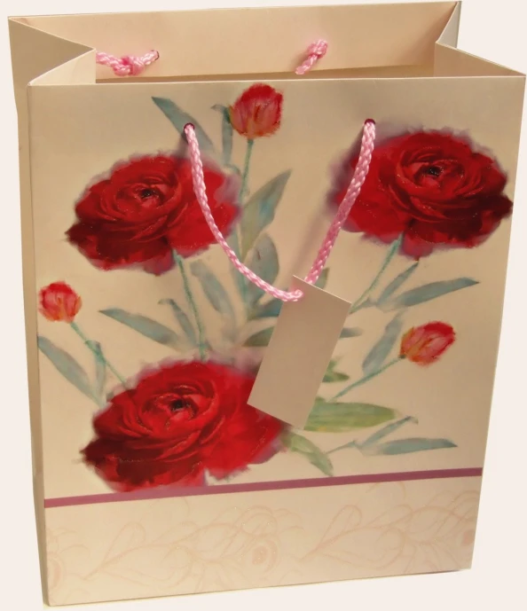 an open bag with roses and a tag attached