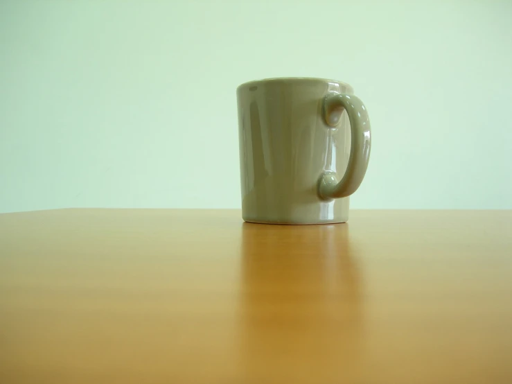 a large white cup sitting on top of a table