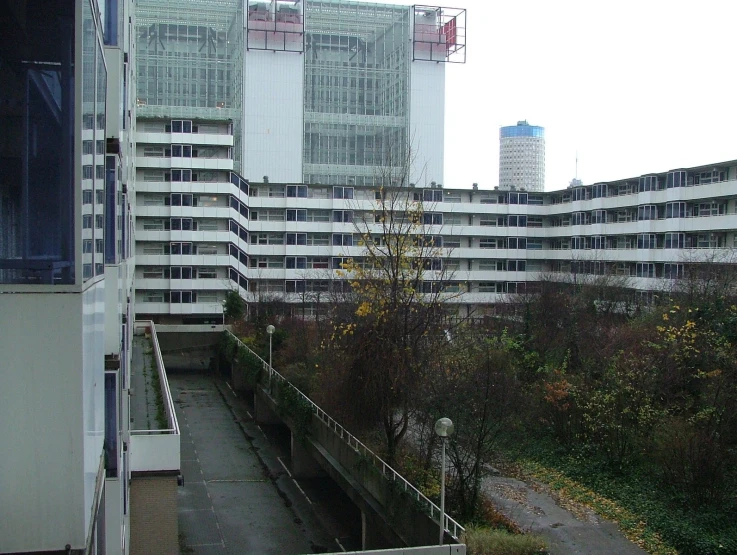 a long walkway with buildings next to it