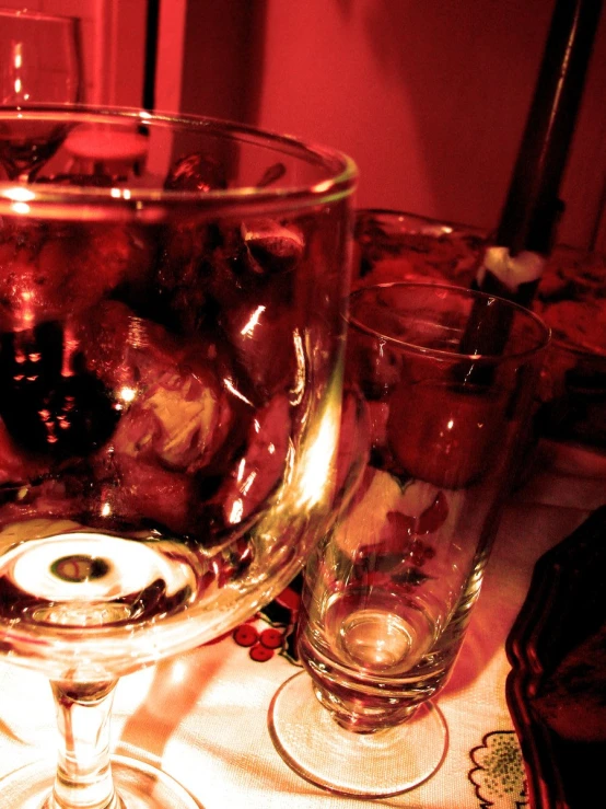 there are three wine glasses that are sitting on a table