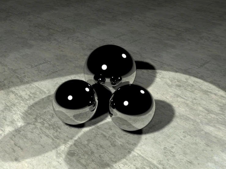 three black vases are sitting on the concrete