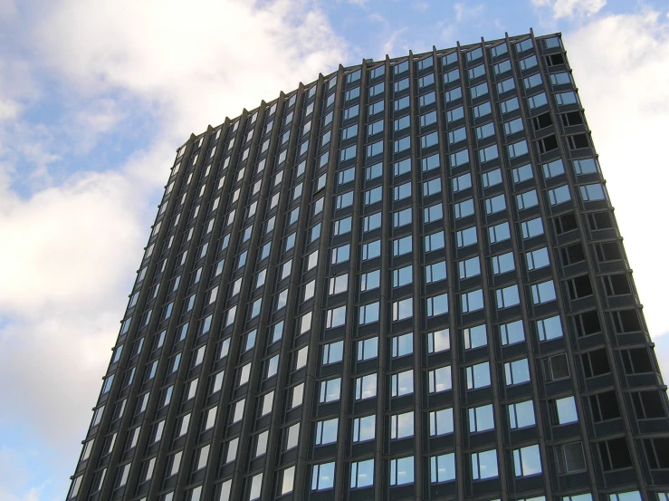 a tall building with lots of windows in the sky