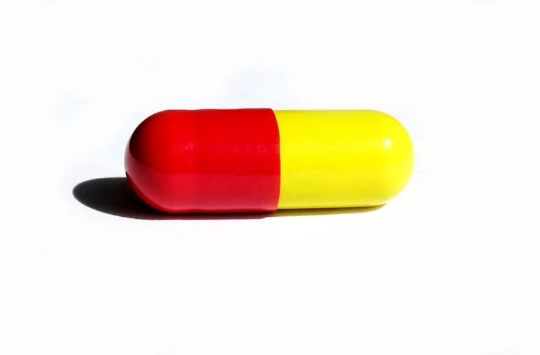 a pill that is yellow and red