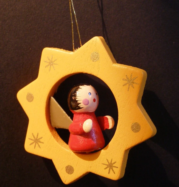 a toy hanging ornament in an empty frame