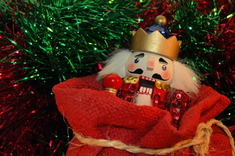 a red cloth covered christmas ornament with a nuter in it