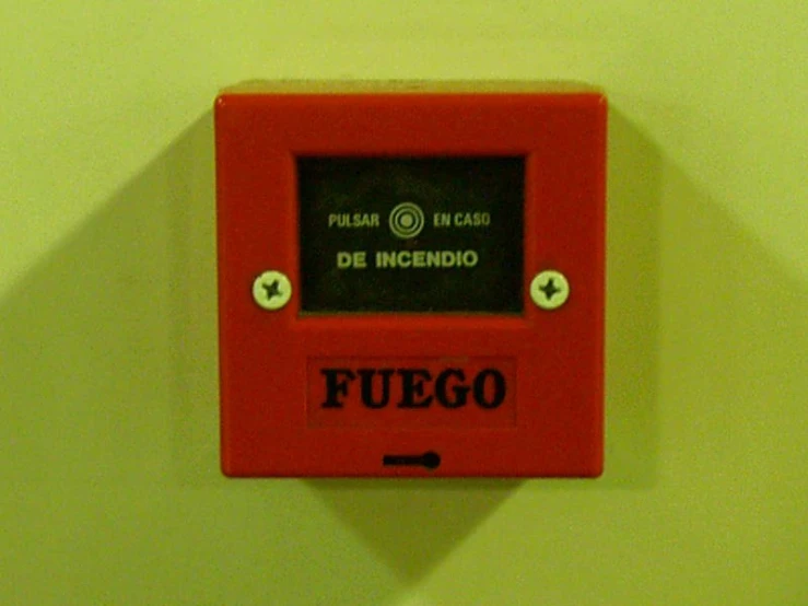 a wall mounted red on with a black screen