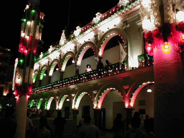 a building with lite up decorations on the side