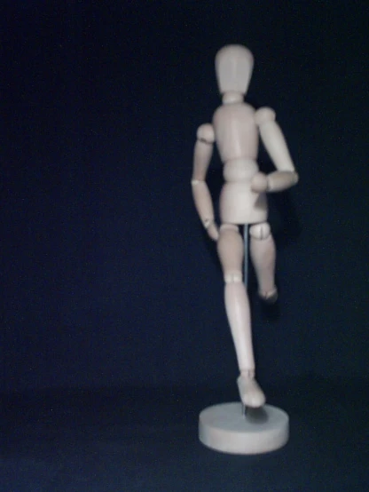 a white dummy is standing with a blue back