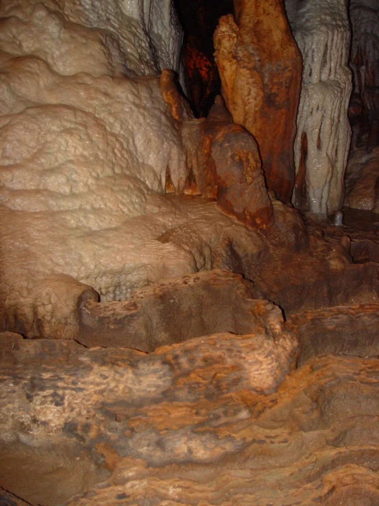 the interior of a cave with rock formations