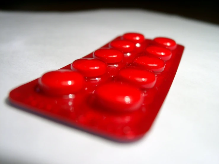 a pill pill shaped like a triangle on a table