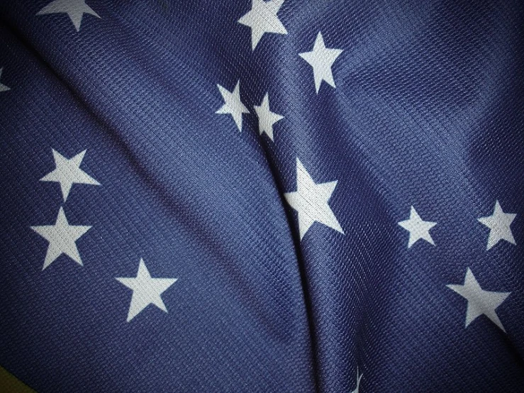 a blue and white flag with stars is pictured