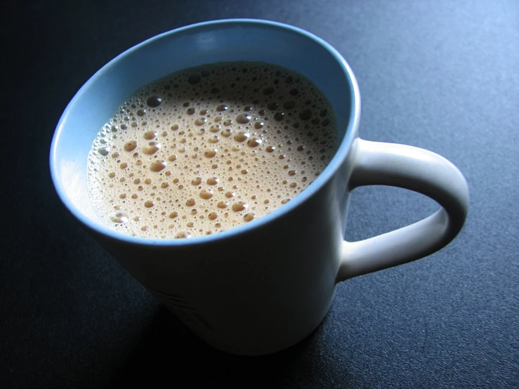 a cup of  chocolate sitting on top of a table