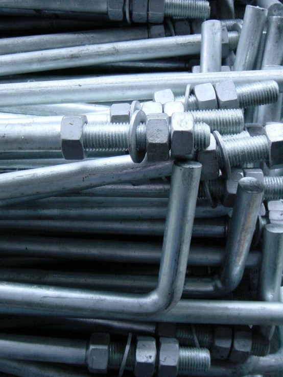 some big bolt and nut wrenches stacked together