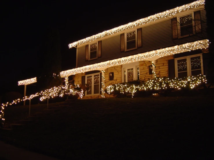 an house is lit up with lights