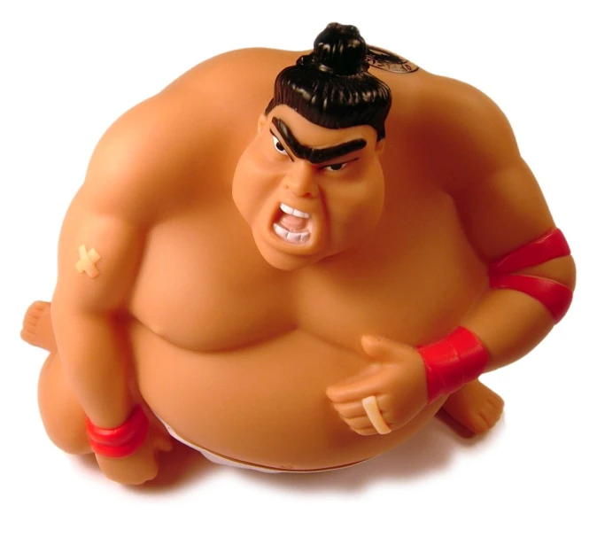 a toy wrestling wrestler holding his belt and facing the camera