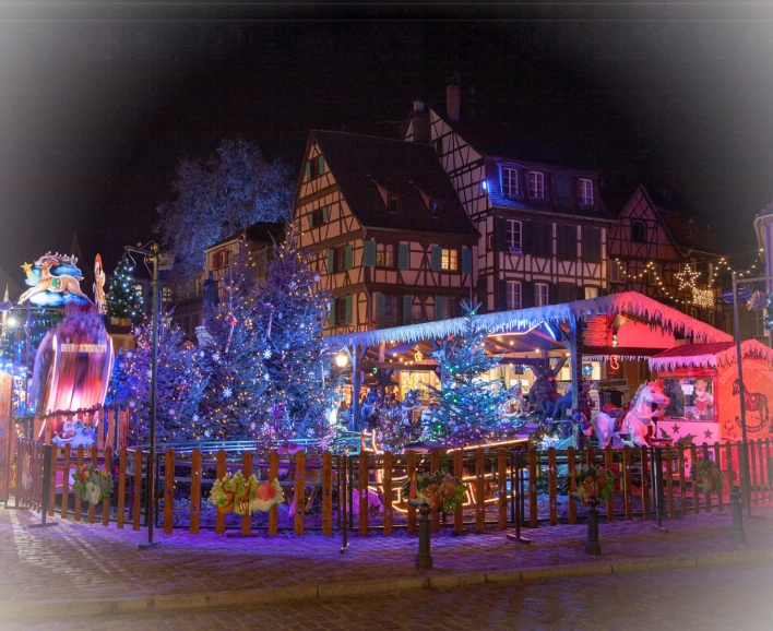 christmas tree displayed in the middle of a small town street