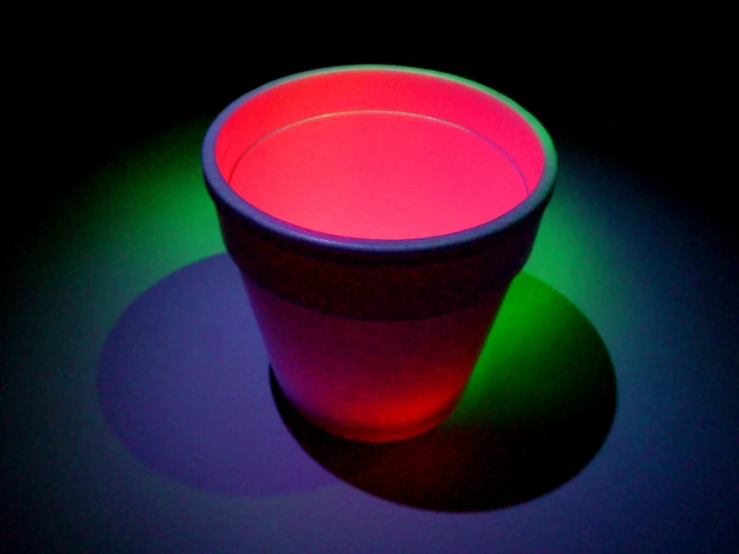 this is a cup on a black surface
