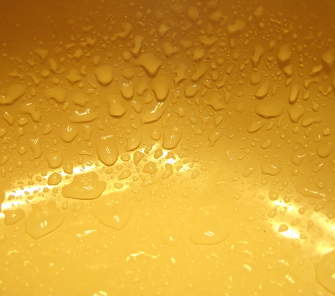 drops of water on the bottom of a yellow bowl