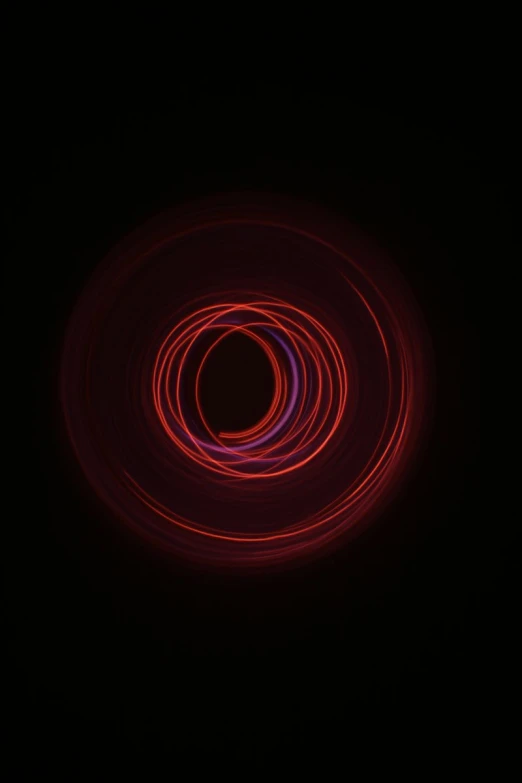 a red ring is seen through the darkness