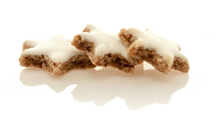 a pile of homemade looking pastries with white icing