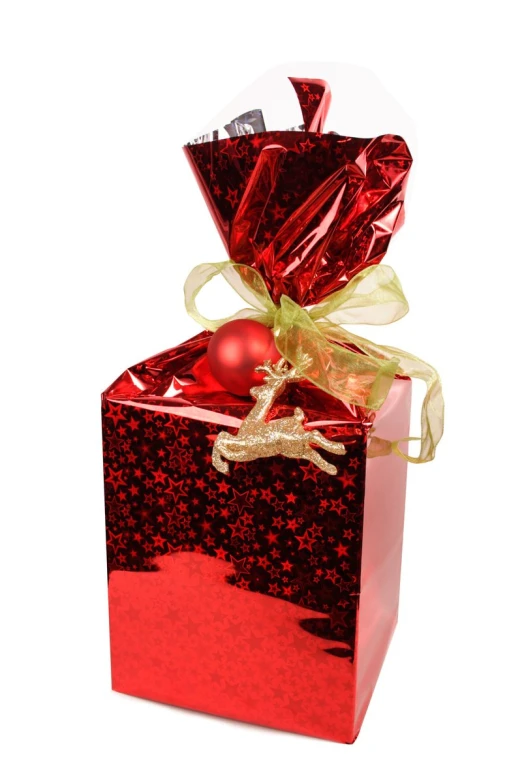 red gift box with gold ribbon and christmas bauble