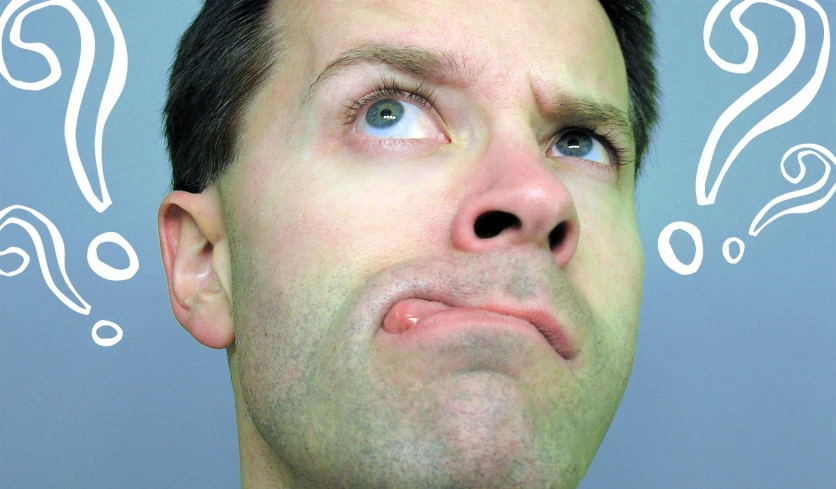 a man looking up into a thought bubble with a question mark above his head