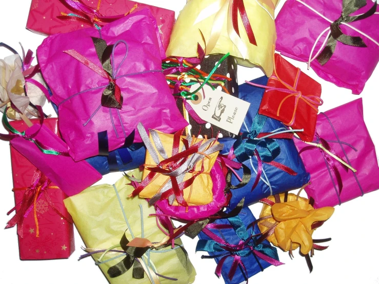 many colored presents are laid out in groups