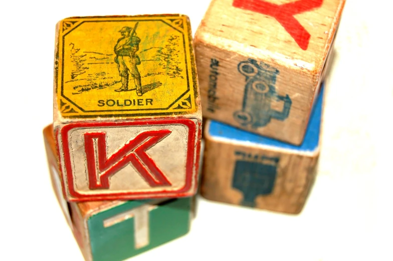 some wooden blocks with an arrow and a soldier stamp