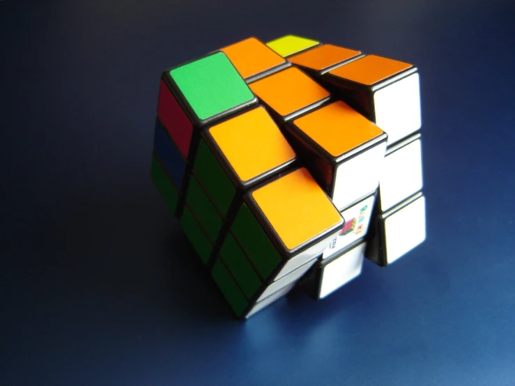 a 3d, multi - colored rubel cube on a table