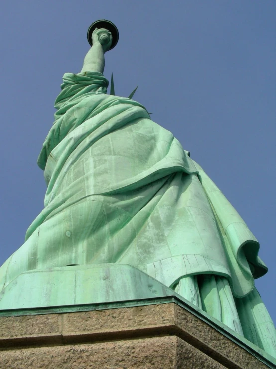 looking up at the face of the statue of liberty