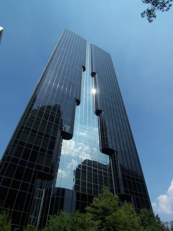 some very tall buildings in the middle of a street