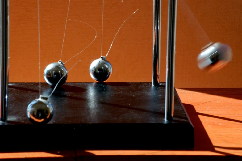 the glass and steel ornaments are on the table