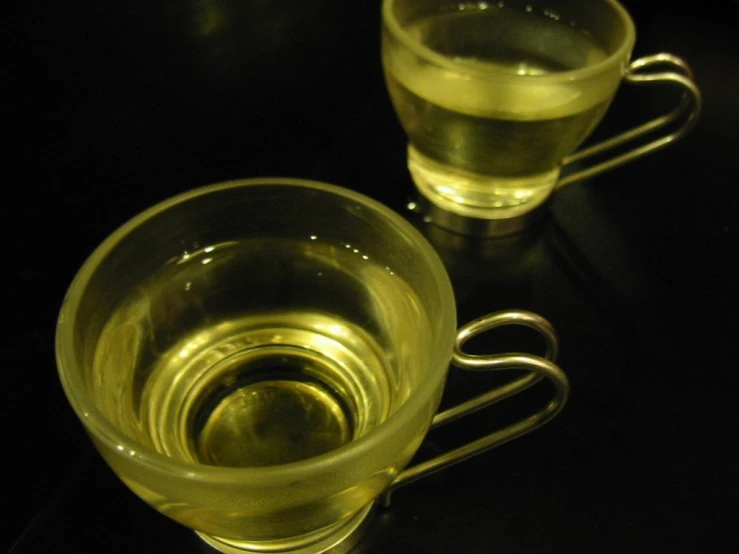 an espresso cup with tea inside it