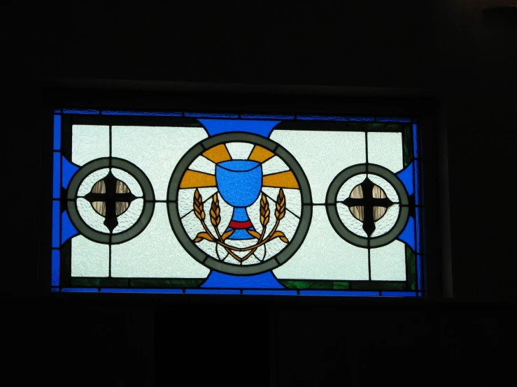 the closeup shows the stained glass window in the interior