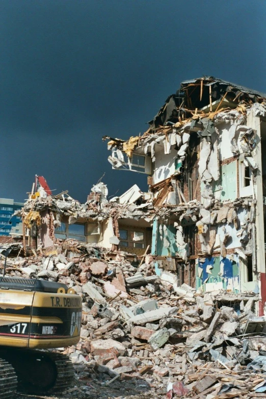 a bus is parked near a destroyed building