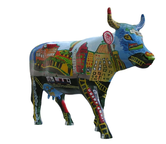 a sculpture of a cow made out of different colored items