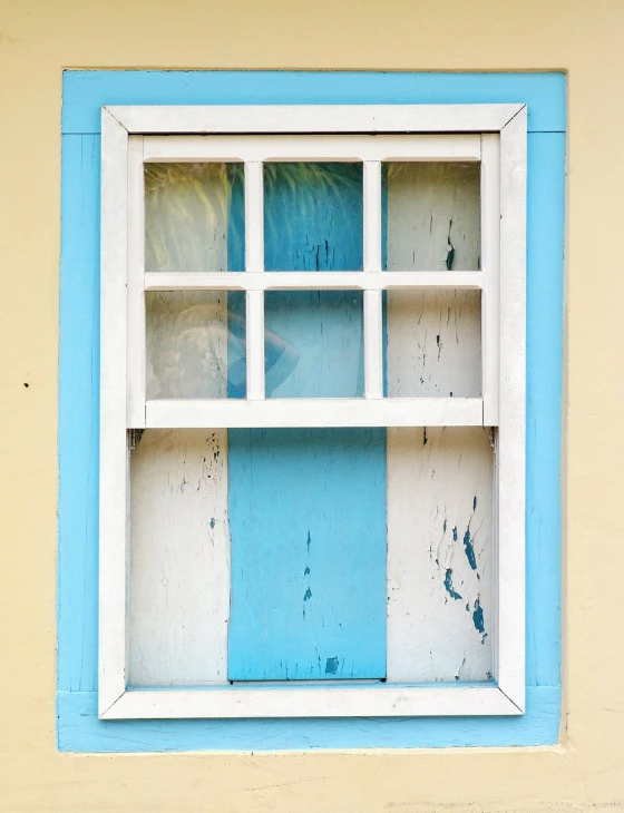 a window of the side of an old building