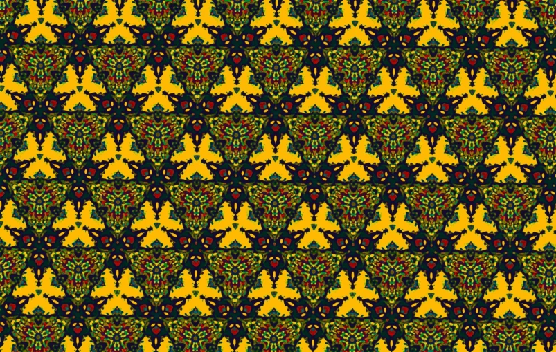 a large yellow, green and black pattern with little fish